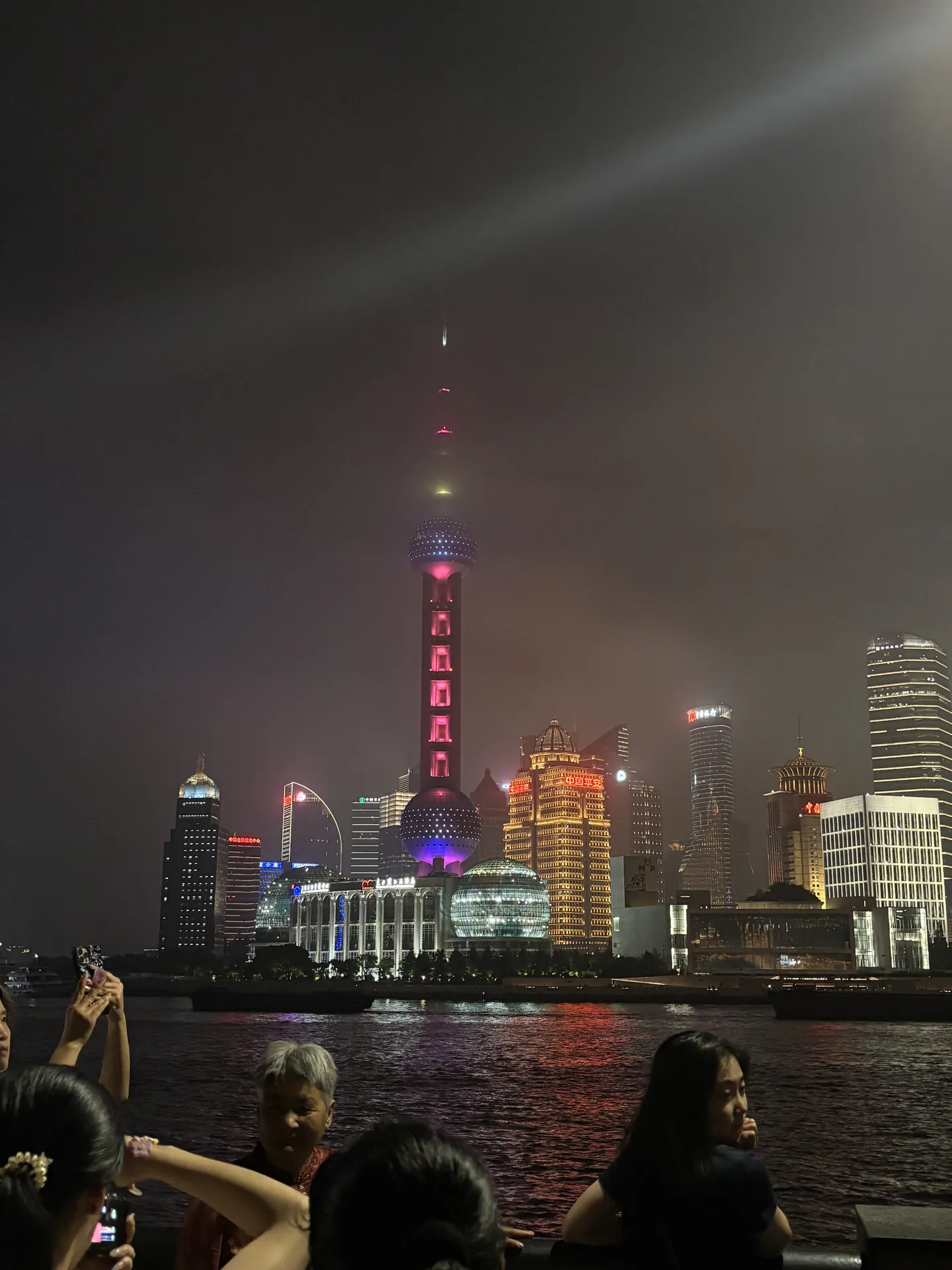 The Shanghai skyline with the Oriental Pearl Tower at night, seen from the Bund